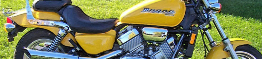 Хонда МАГНА 750 2003 года выпуска вид сбоку в жёлтом цвете